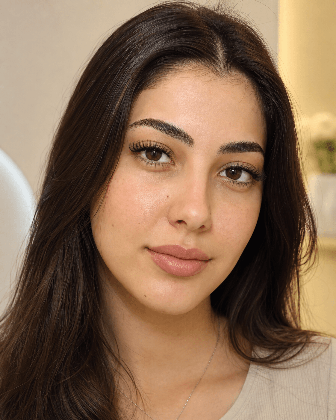 Campaign detail: close crop of classic lash extensions and a bare, glowing complexion