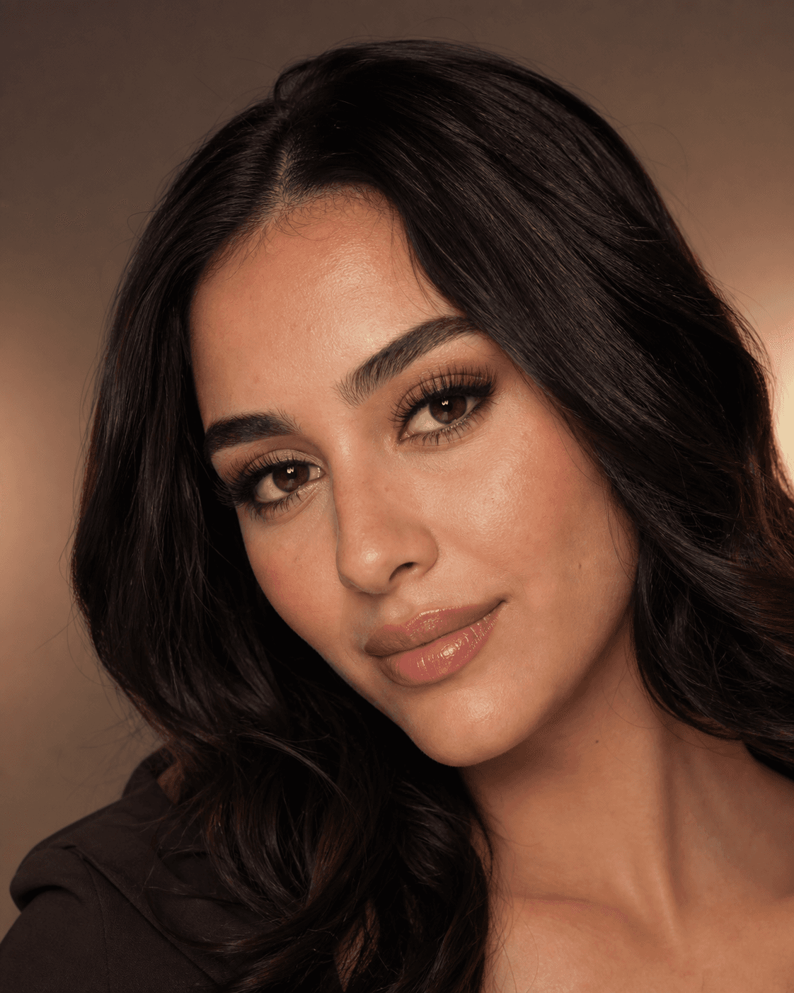 Campaign detail: soft volume lash extensions and warm bronze lid